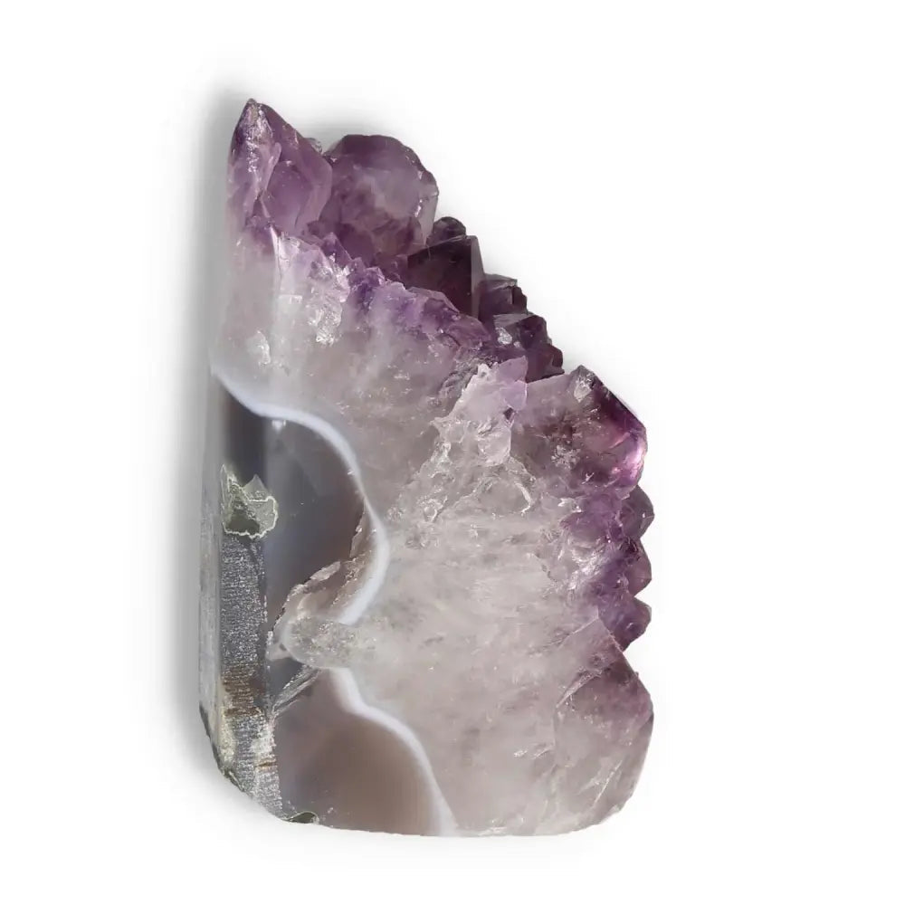 Amethyst cut base geode showcasing vivid violet hues, a premium piece by Sylvia Crystals, known for stress relief and focus enhancement.