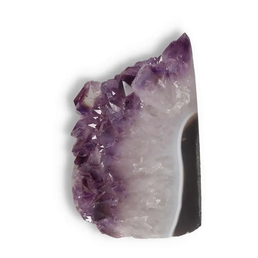 Amethyst cut base geode with violet hue from Sylvia Crystals, known for enhancing focus and stress relief. Exquisite craftsmanship.