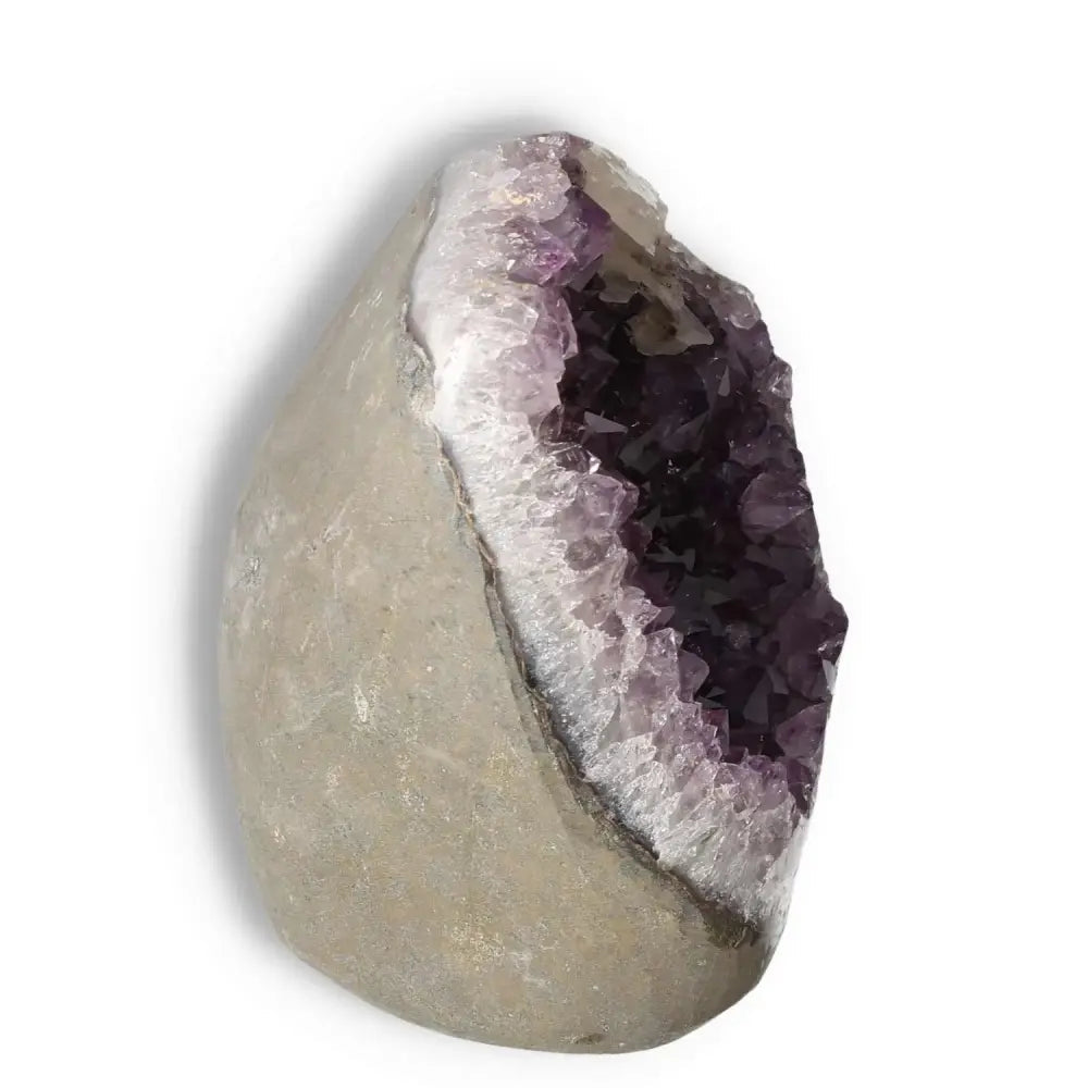 Amethyst cut base geode by Sylvia Crystals, known for enhancing mental clarity and emotional balance with stress-relieving properties.