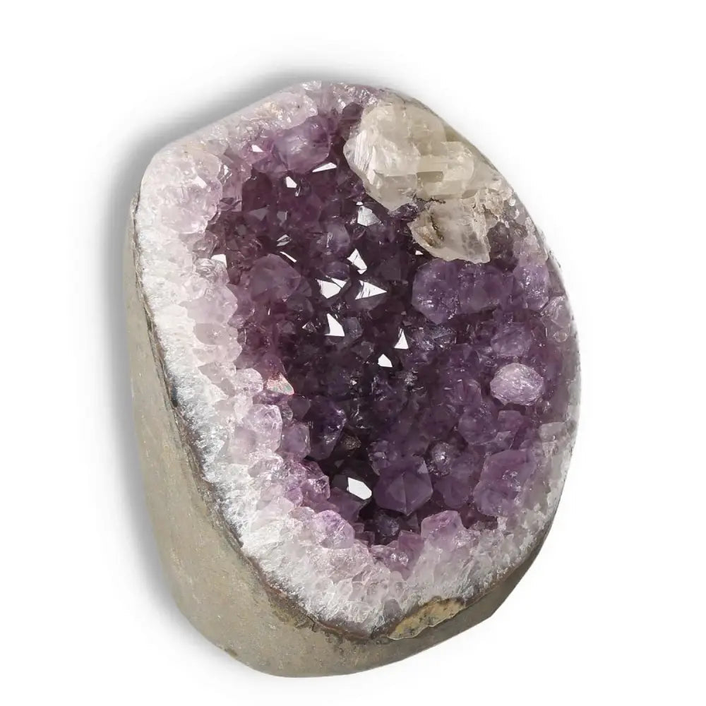 Amethyst cut base geode from Sylvia Crystals, showcasing vibrant purple crystals for stress relief and mental clarity.