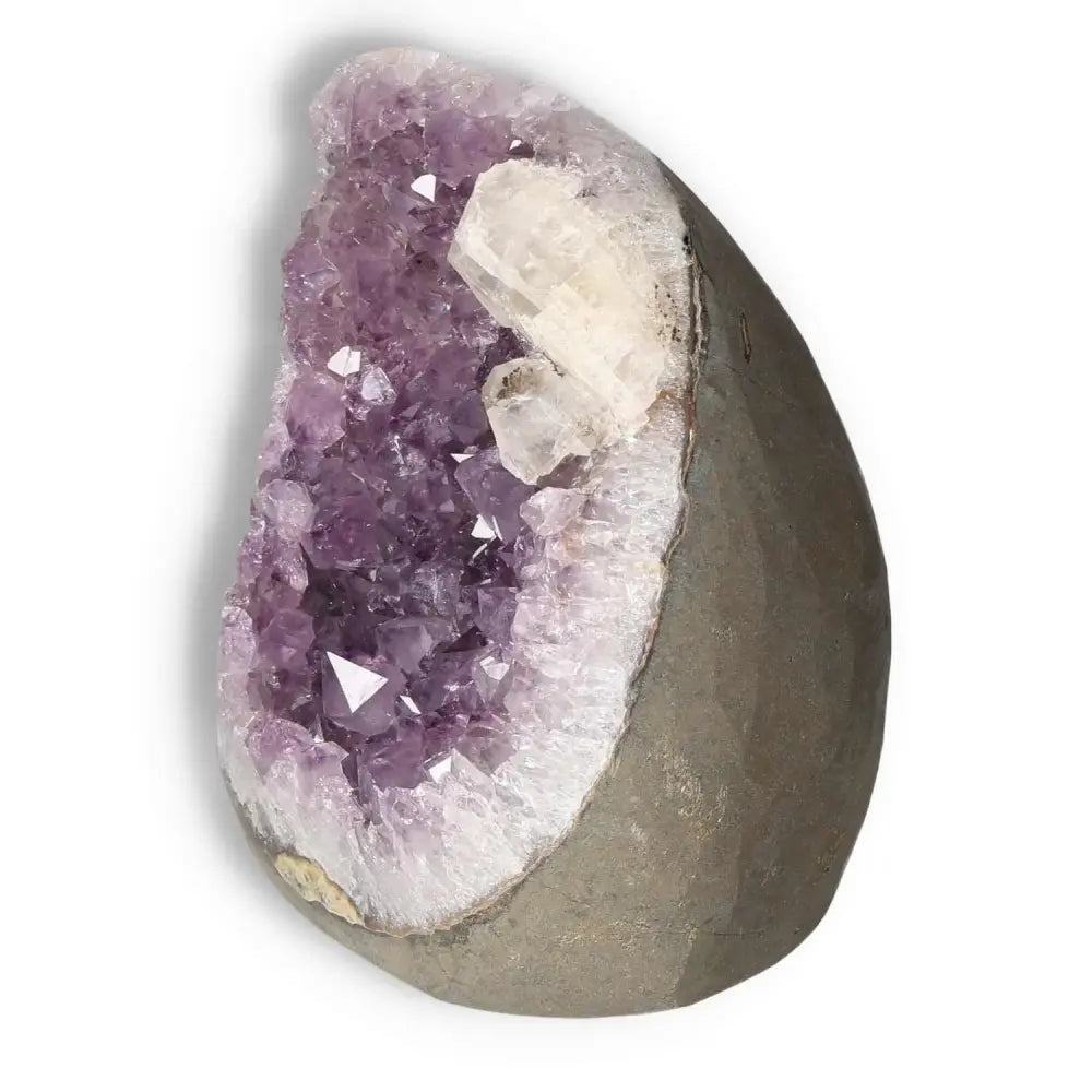 Amethyst cut base geode by Sylvia Crystals, showcasing vibrant purple crystals, known for stress relief and mental clarity benefits.