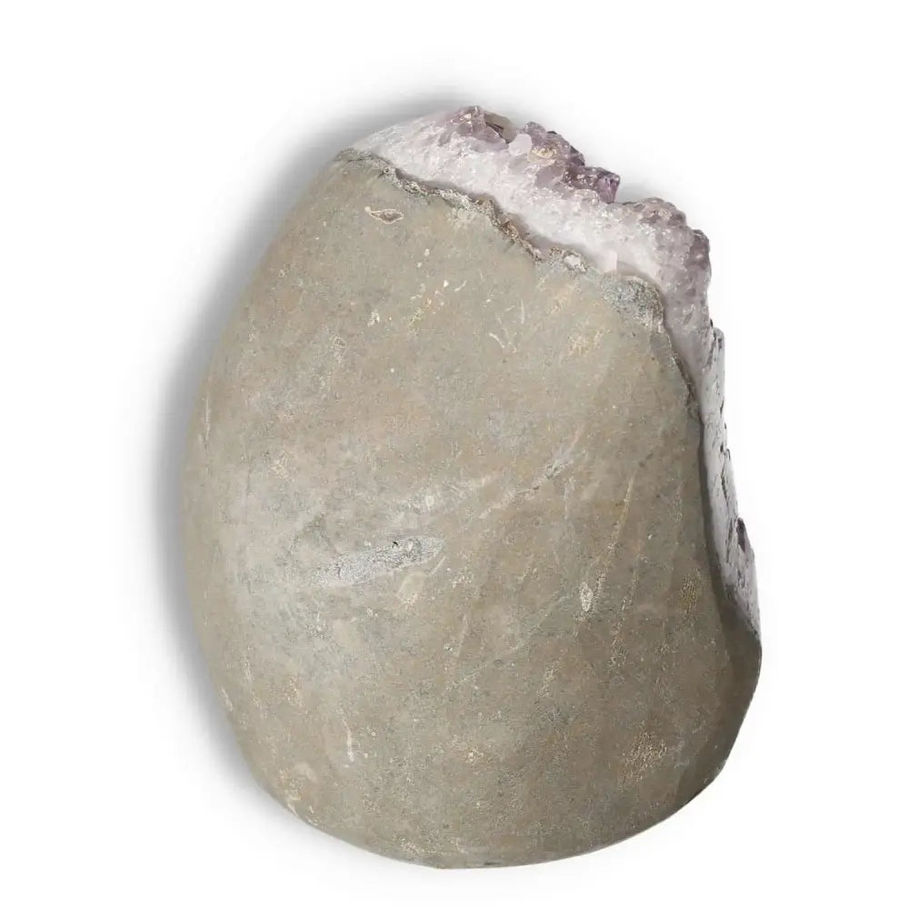 Amethyst cut base geode by Sylvia Crystals, showcasing natural stone texture and purple crystal highlights, ideal for decor and wellness.