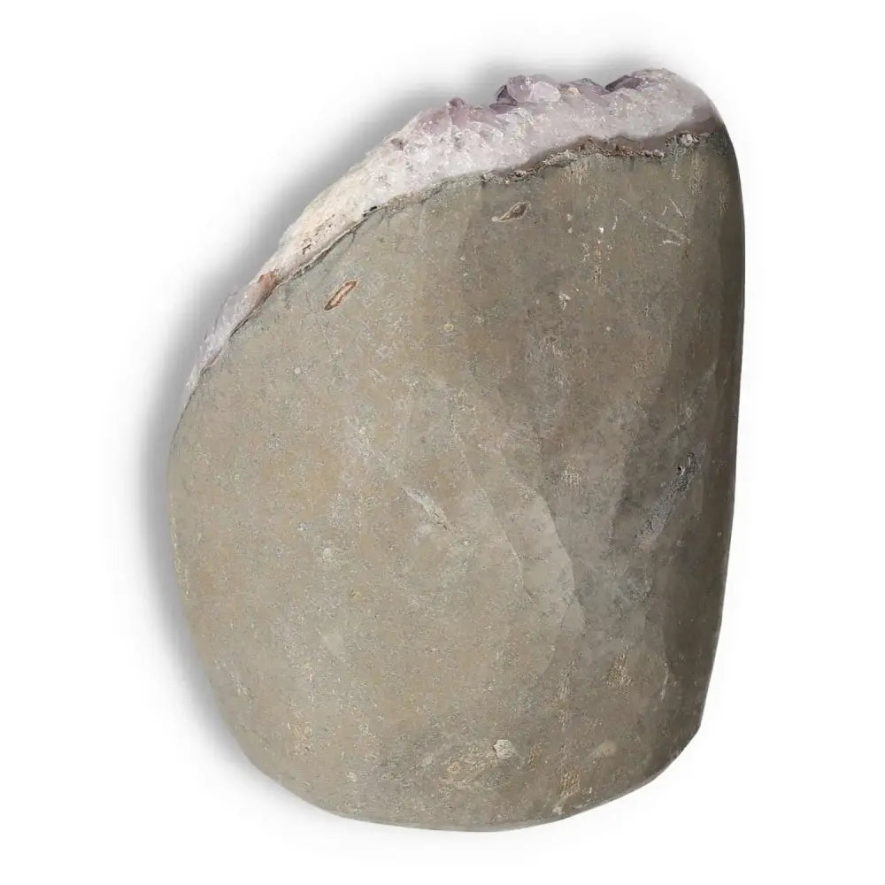 Amethyst cut base geode from Sylvia Crystals; a decorative piece known for stress-relieving properties and emotional balance benefits.