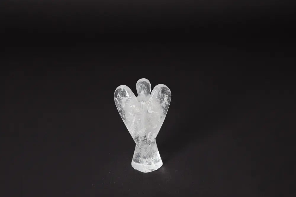 Angel Lemurian Quartz crystal sculpture on black background, stands 10 cm tall; enhances emotional stability, reduces stress, boosts energy.