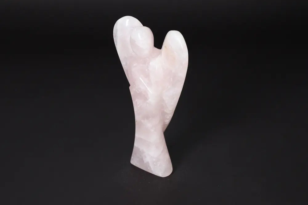 Angel-shaped rose quartz statue, 15 cm, known for its purifying energy and ability to neutralize negative vibrations and radiation.