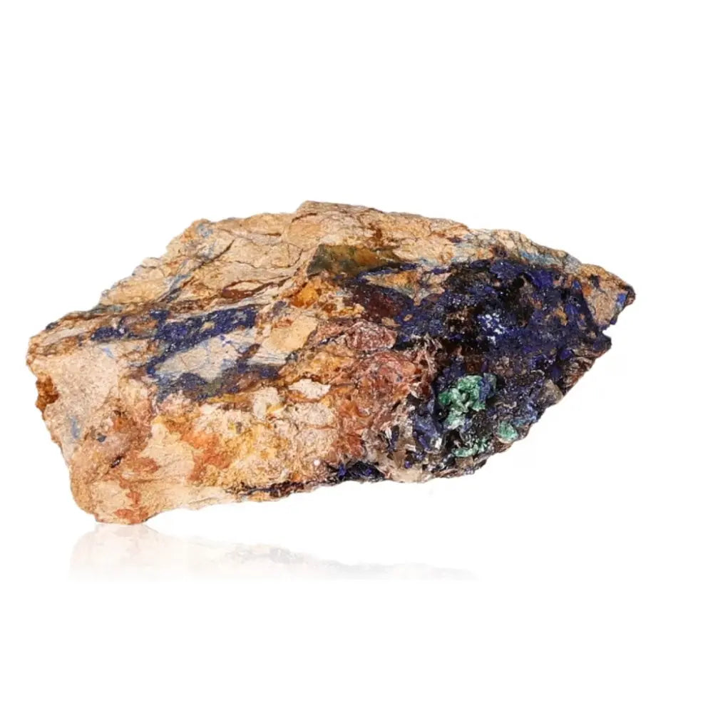 Azurite mineral rock displaying deep blue hues and unique patterns, known for enhancing mental clarity and self-awareness.