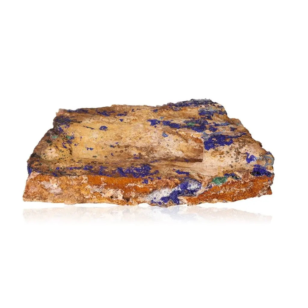 Azurite gemstone showcasing deep blue hues and unique patterns, known for enhancing mental clarity and self-awareness.