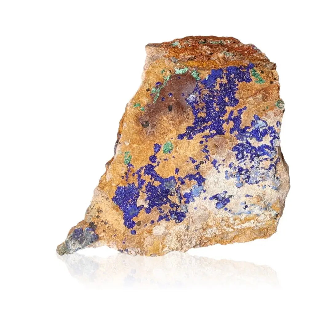 Azurite druzy mineral with deep blue hues, enhancing intuition and spiritual insight, on a textured rock surface.