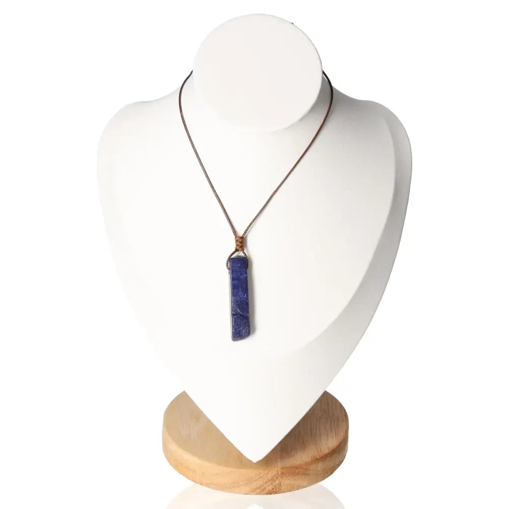 Boho Necklace Lapis Lazuli on display stand, showcasing vibrant blue stone with bohemian elegance and spiritual significance.