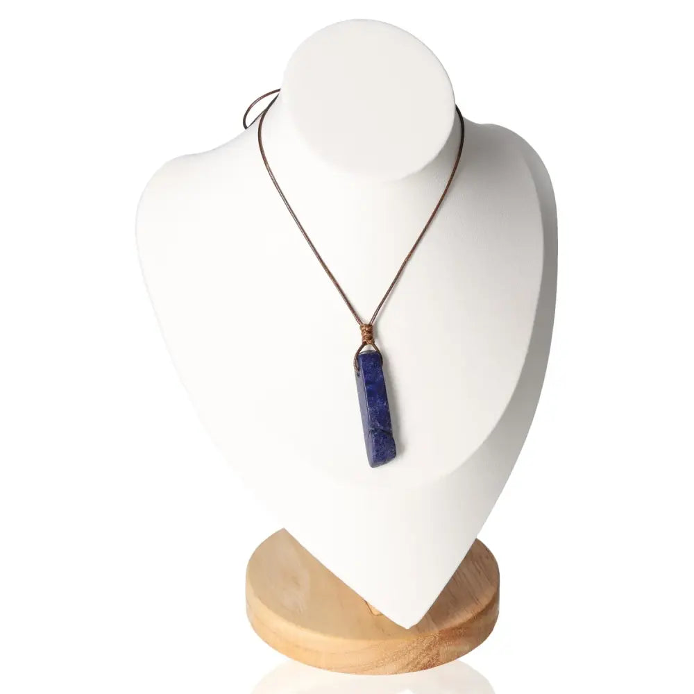 Boho Necklace with Lapis Lazuli pendant on display stand, showcasing its elegant bohemian design and spiritual significance.