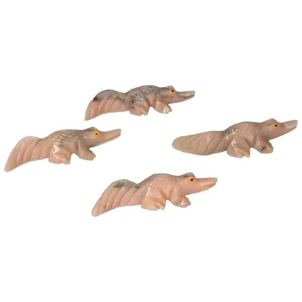 Carved Dolomite Alligator statues with grounding properties, symbolizing tranquility and emotional balance, by Sylvia Crystals.