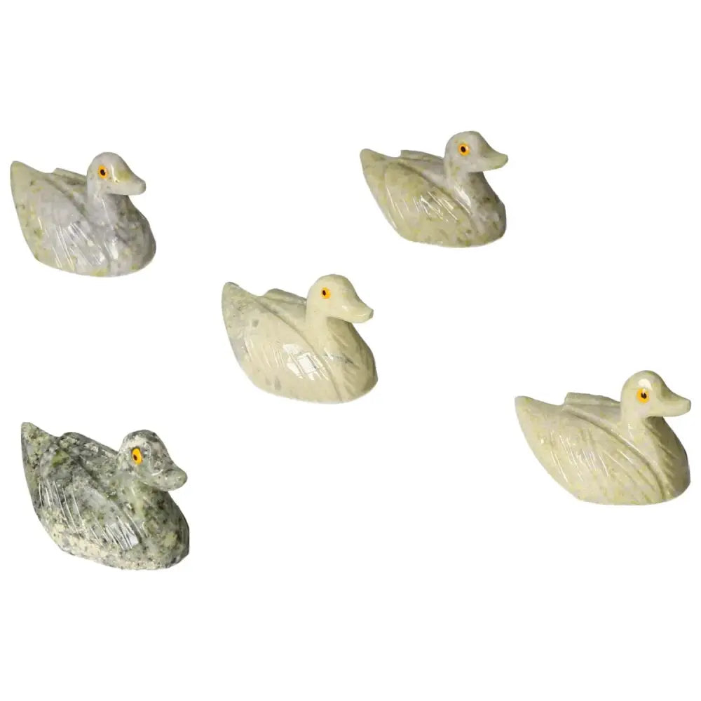 Set of five carved dolomite ducks showcasing elegance and tranquility, ideal for emotional balance and home decor by Sylvia Crystals.