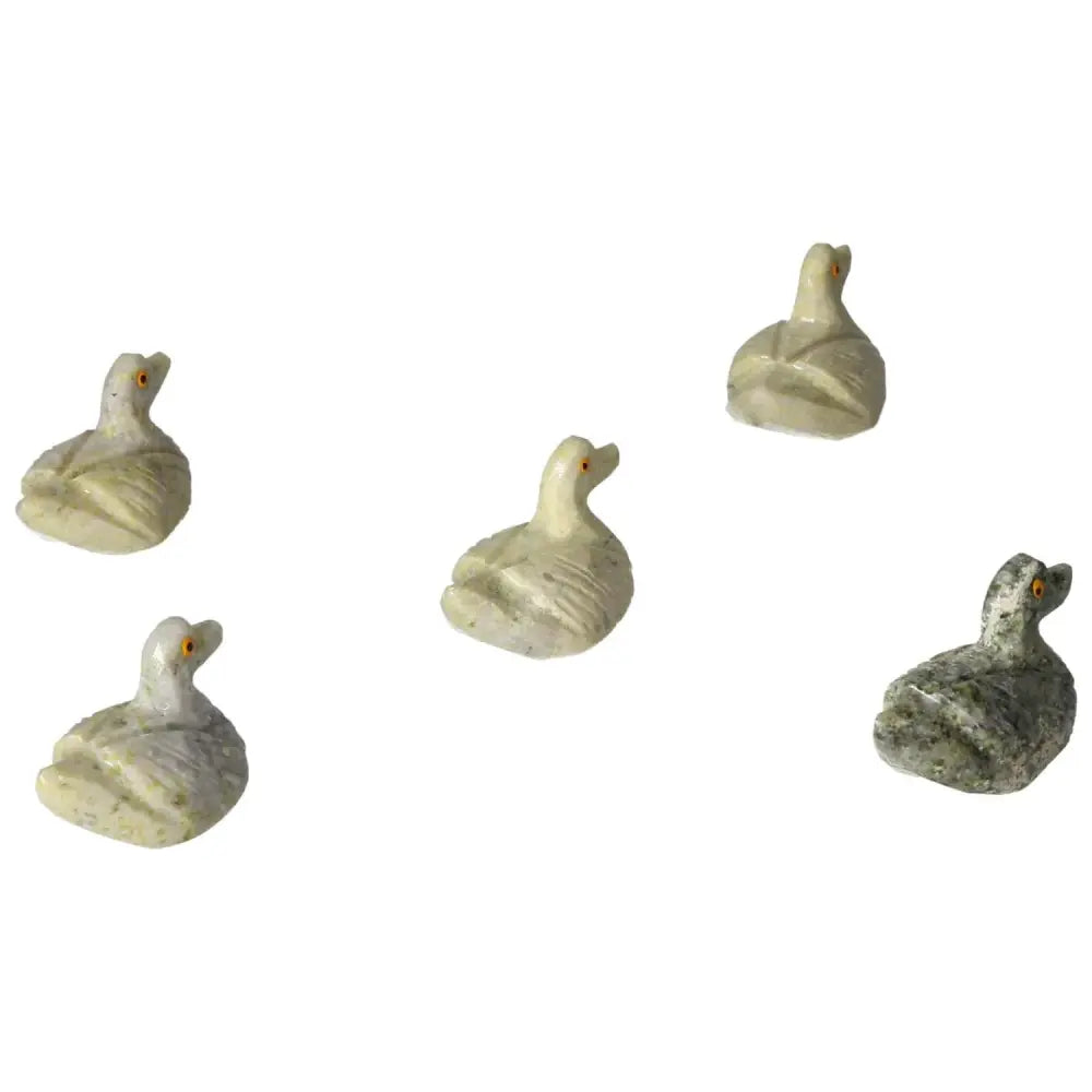 Carved dolomite ducks by Sylvia Crystals, showcasing handpicked quality and calming elegance for emotional balance and tranquility.