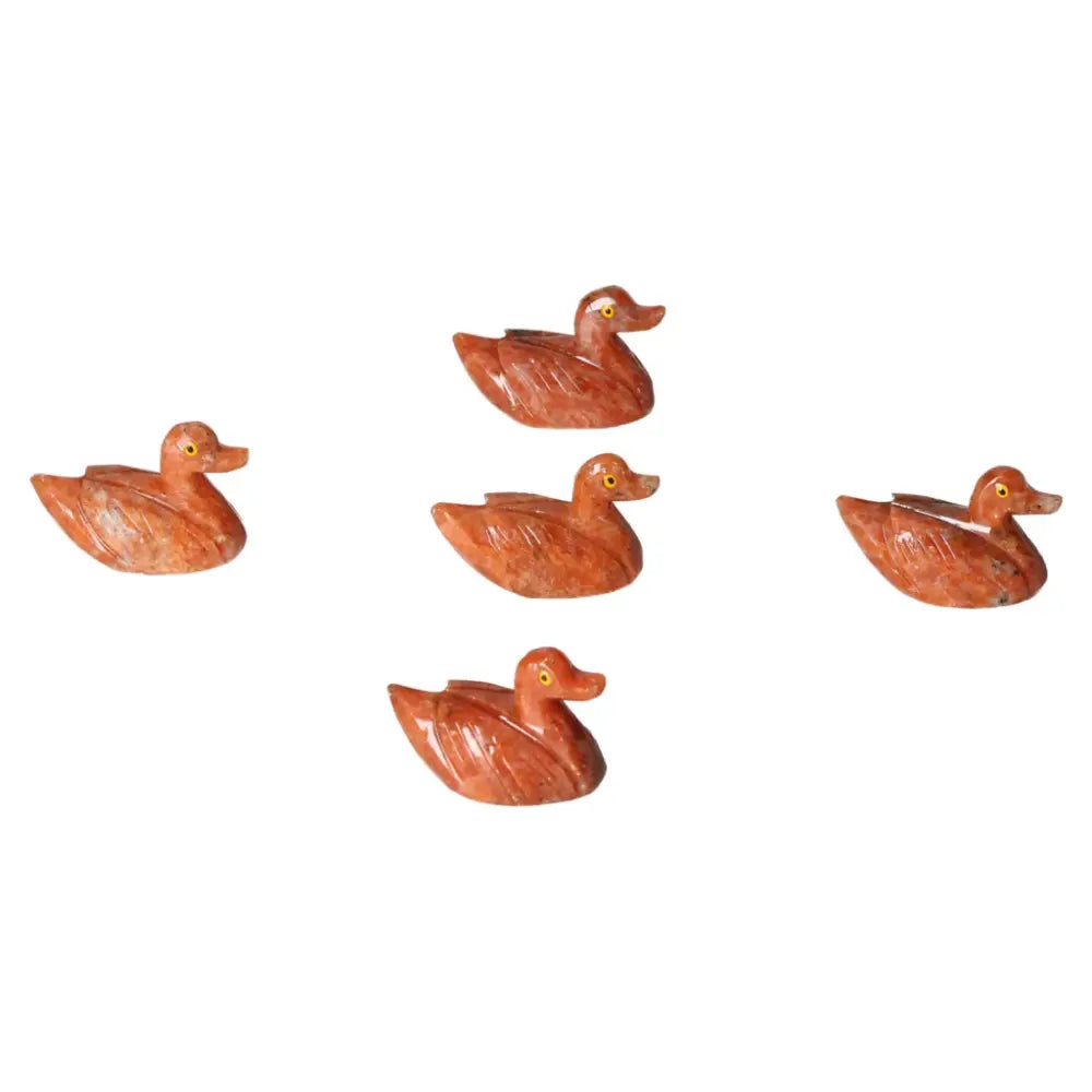Handcrafted carved dolomite ducks, showcasing Sylvia Crystals' artistry and promoting tranquility and well-being.