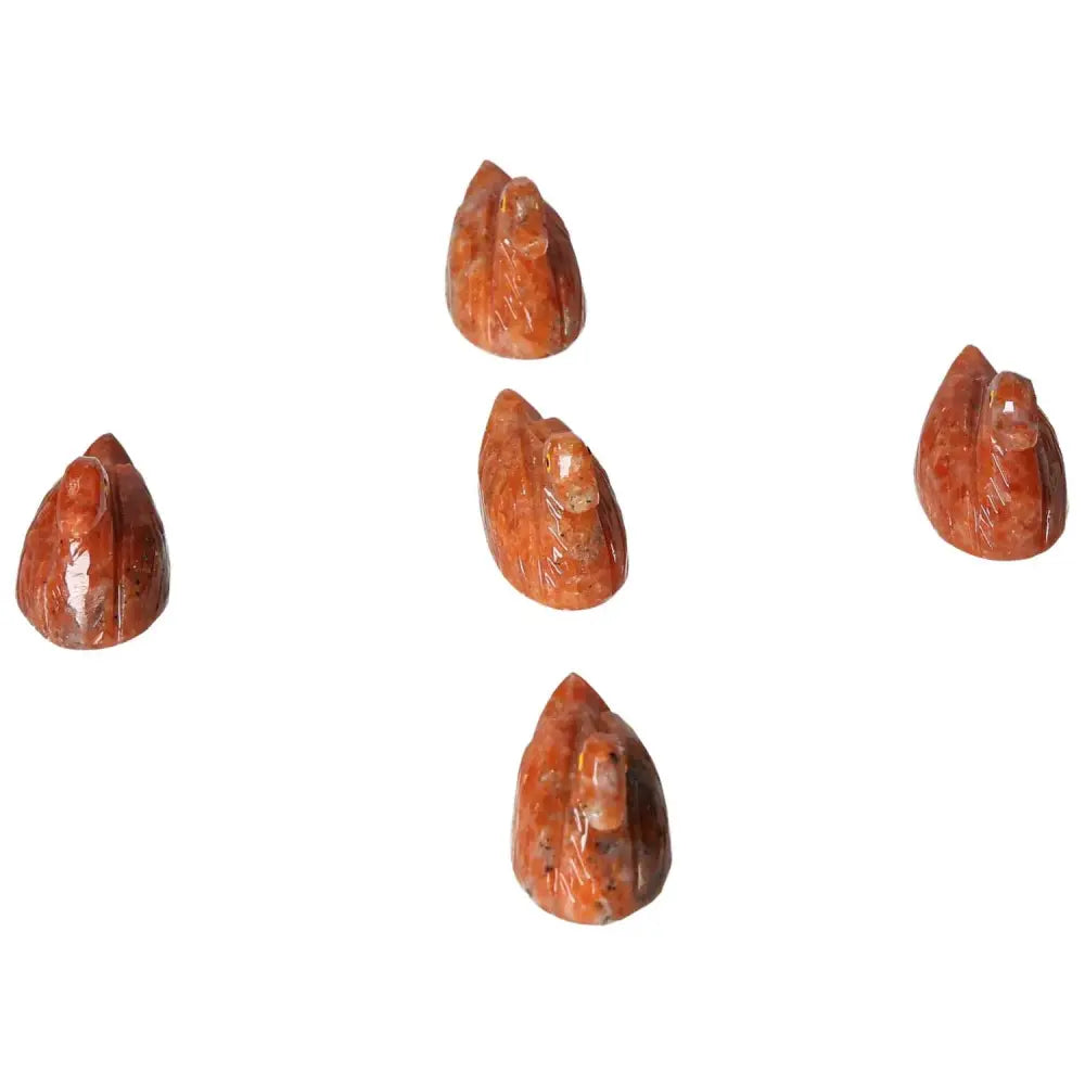 Five handcrafted Carved Dolomite Ducks showcasing premium artistry and natural beauty, offered by Sylvia Crystals.