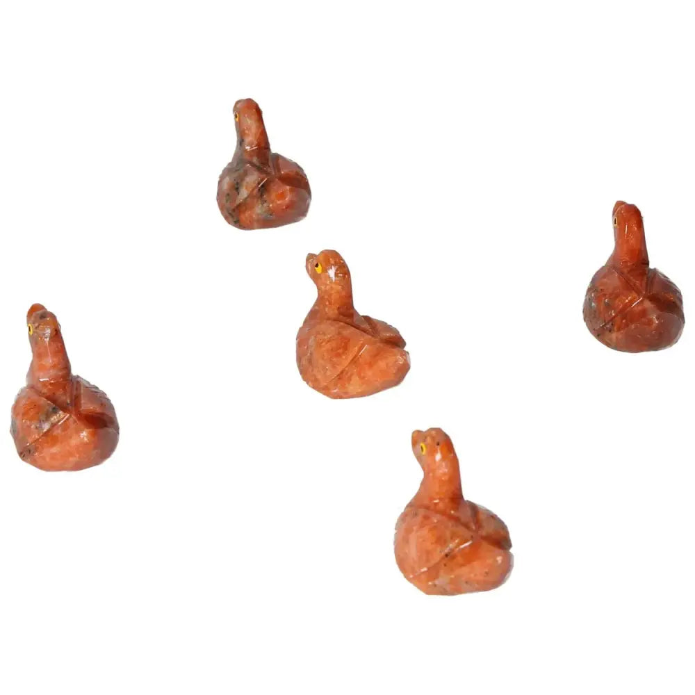 Carved Dolomite Duck figurines by Sylvia Crystals showcasing exquisite craftsmanship and natural artistry for emotional tranquility.
