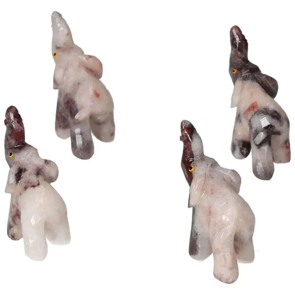 Carved Dolomite Elephant figurines displayed in various angles highlighting their intricate craftsmanship and natural stone patterns.