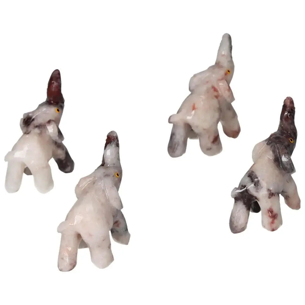Carved Dolomite Elephants from Sylvia Crystals, showcasing premium craftsmanship and soothing elegance; perfect home decor.
