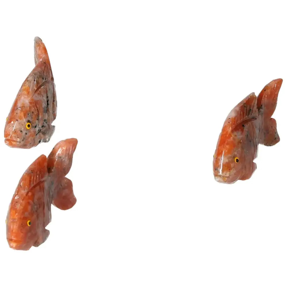 Carved Dolomite Fish sculptures by Sylvia Crystals, showcasing authentic craftsmanship and quality, made to cleanse energy and promote harmony.