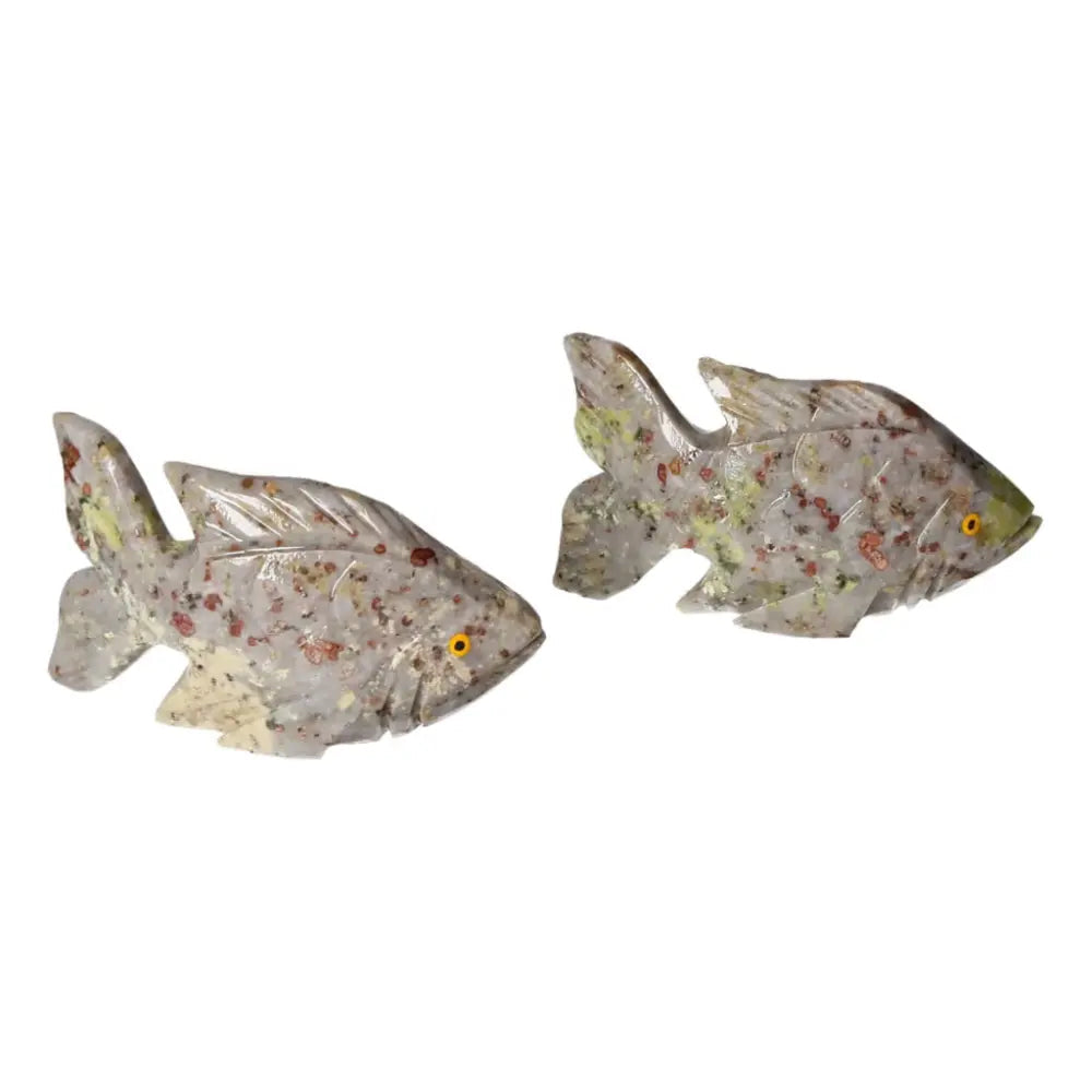 Carved dolomite fish with intricate details, promoting tranquility and balance, from Sylvia Crystals.