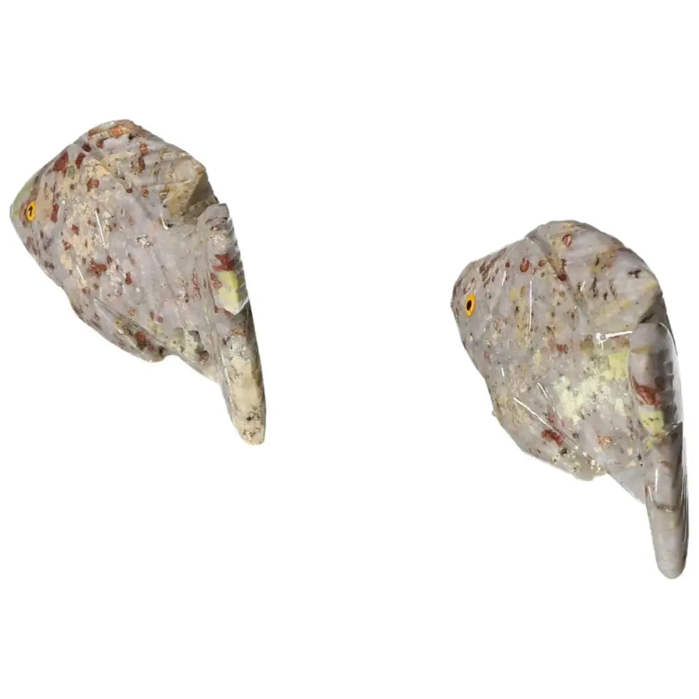 Two carved dolomite fish figurines promoting tranquility and emotional balance, from Sylvia Crystals.