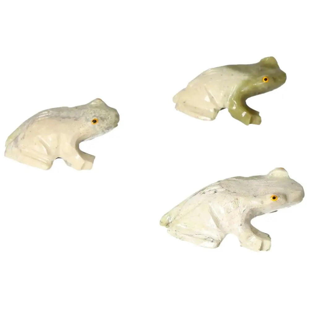 Three carved dolomite frogs from Sylvia Crystals symbolizing serenity and emotional balance in natural hues.