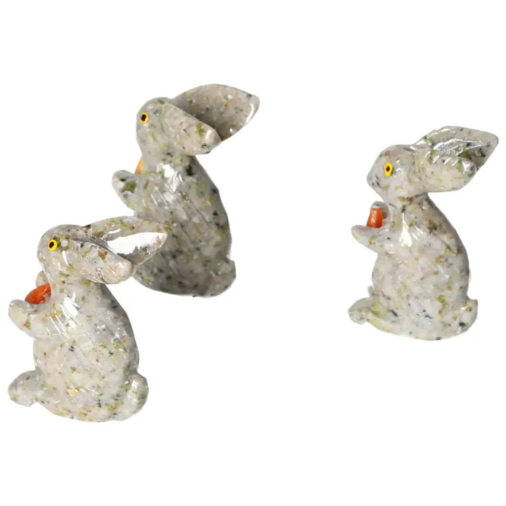 Three carved dolomite rabbit sculptures by Sylvia Crystals, each displaying intricate design and calming elegance.