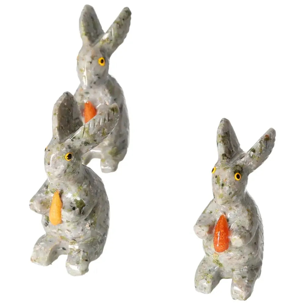 Three carved dolomite rabbit sculptures by Sylvia Crystals, enhancing décor with elegance and grounding emotional benefits.