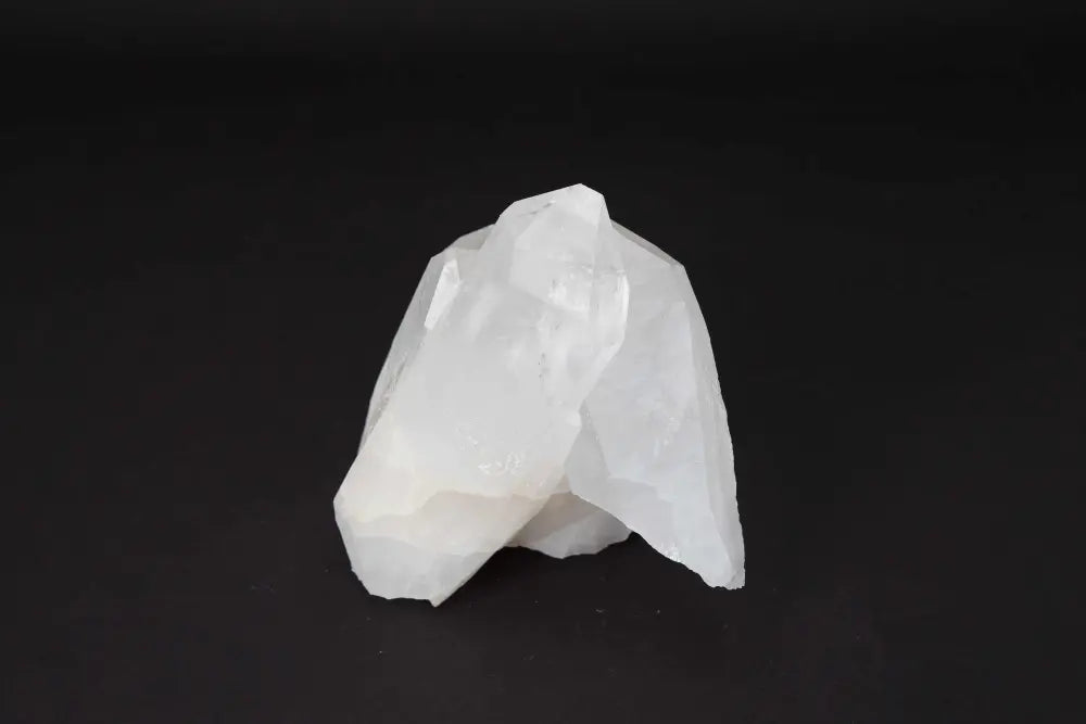 Clear Quartz Cluster emitting pure energy, showcasing its multiple crystal points for amplifying intention and purifying spaces.