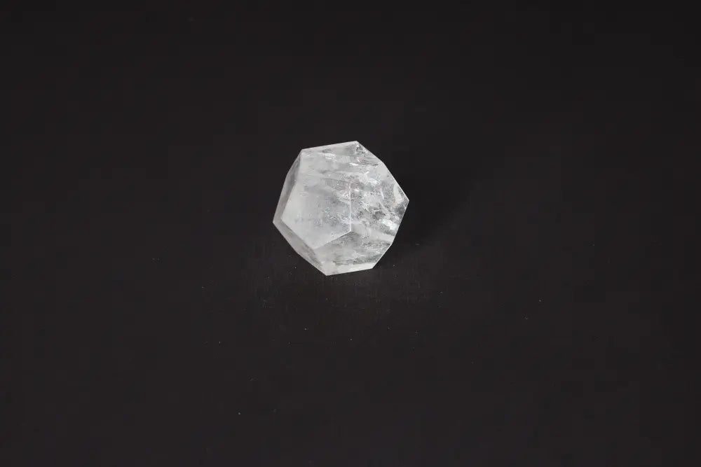 Clear Quartz Geometric Sphere 5 cm for purification and energy harmonization against a dark background