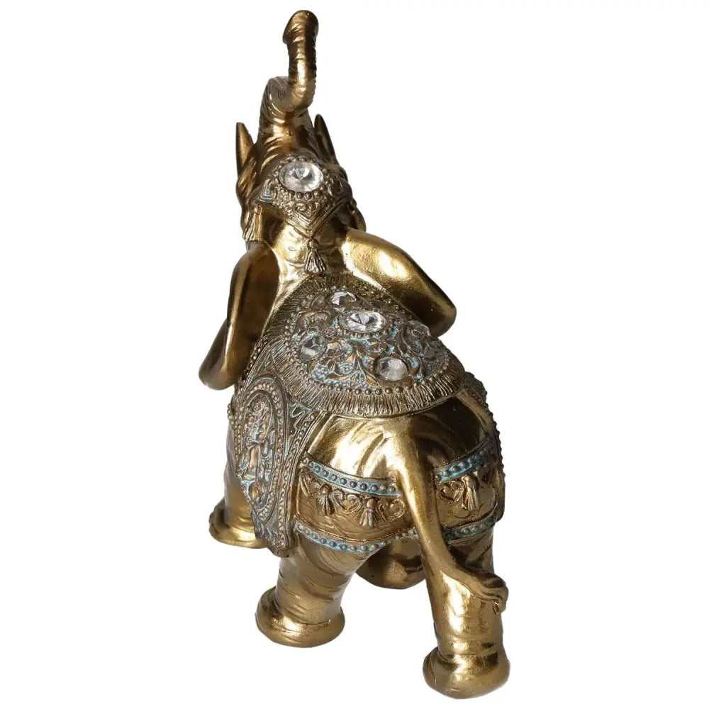 Gold elephant home decor figure by Sylvia Crystals, symbolizing wisdom and strength with intricate detailing and a serene presence.