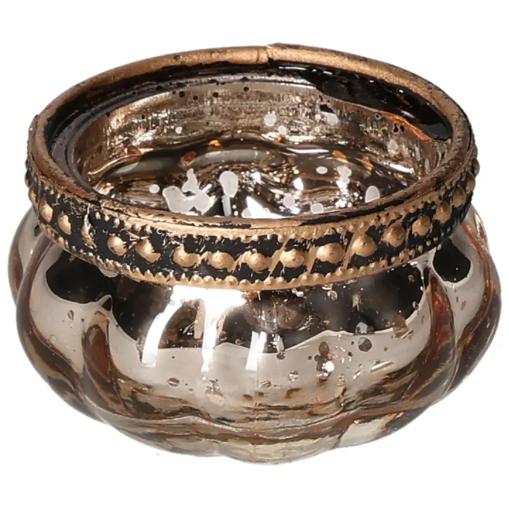 Luxurious gold candle holder with intricate detailing, enhancing elegance and spiritual harmony in home decor.
