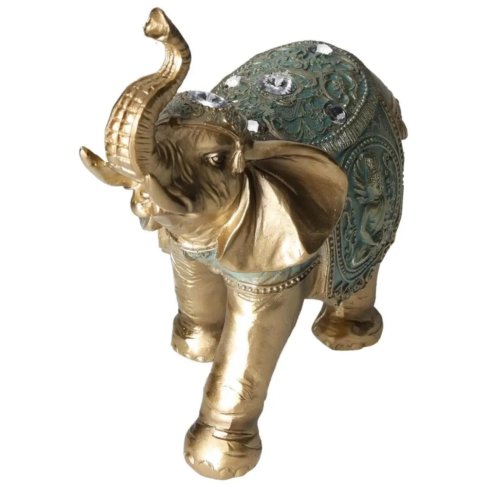 Elegant gold polyresin elephant figurine, adorned with intricate detailing and crystals, symbolizing luxury and harmony.
