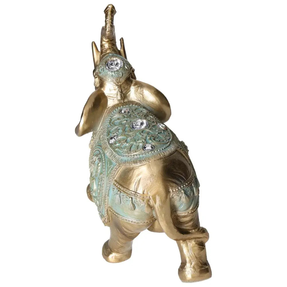 Gold polyresin elephant statue by Sylvia Crystals with intricate details and sparkling embellishments, symbolizing luxury.