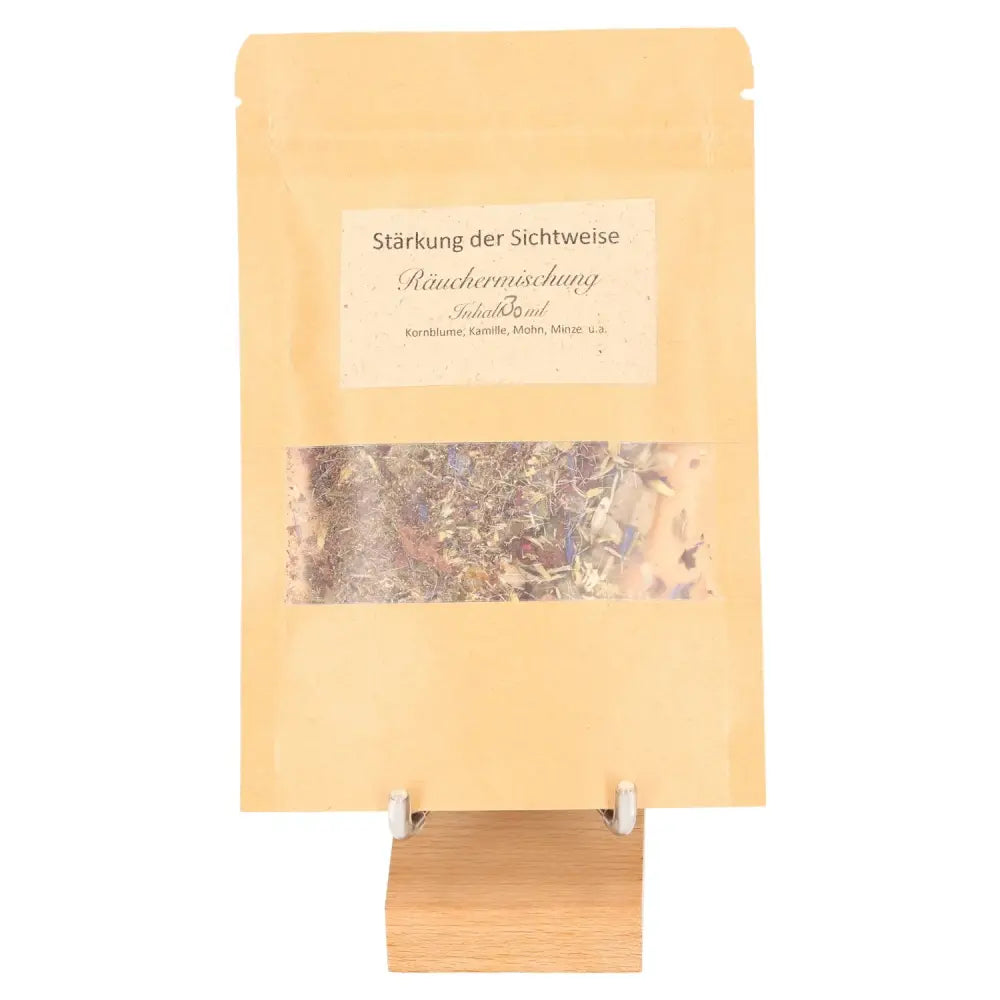 Incense Blend "Strengthening Perspective" in a natural brown bag on a wooden stand, designed for mindfulness and clear communication.