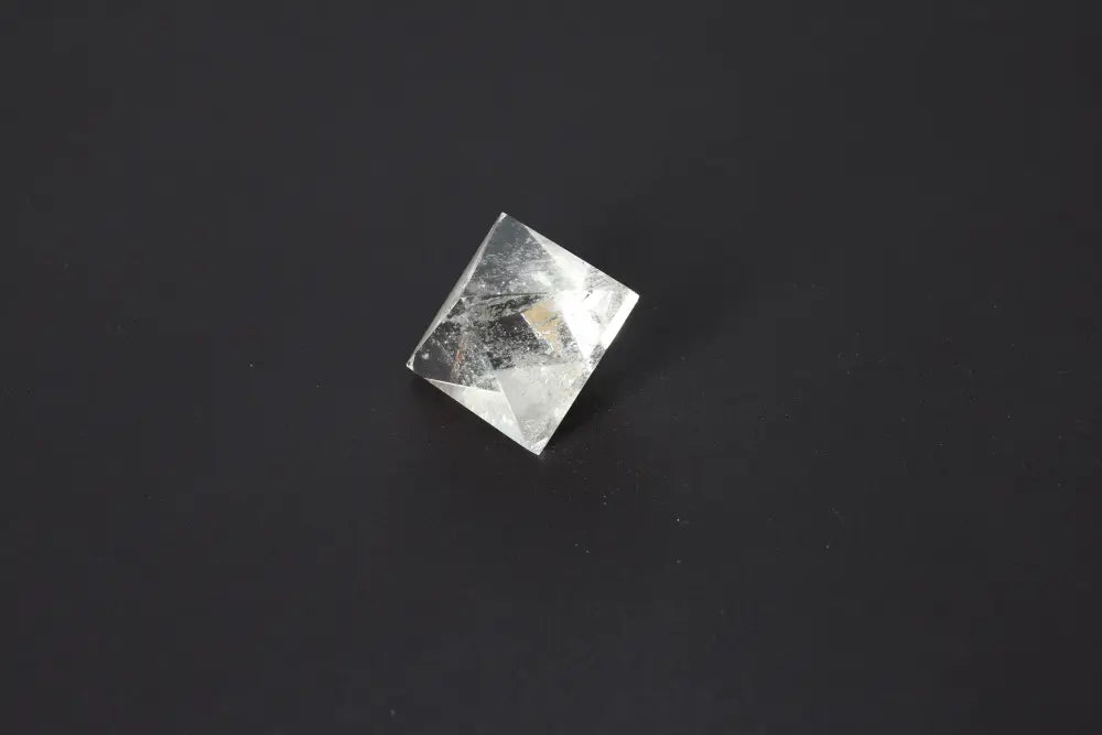 Lemurian Quartz Double Pyramid 3.5 cm on a dark background, showcasing its distinct striations and ethereal clarity for spiritual connection.