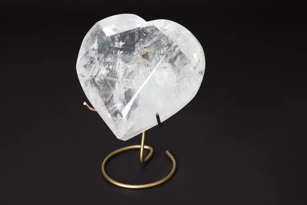 Lemurian Quartz Geometric Heart displayed on a stand, showcasing its clarity and intricate design.