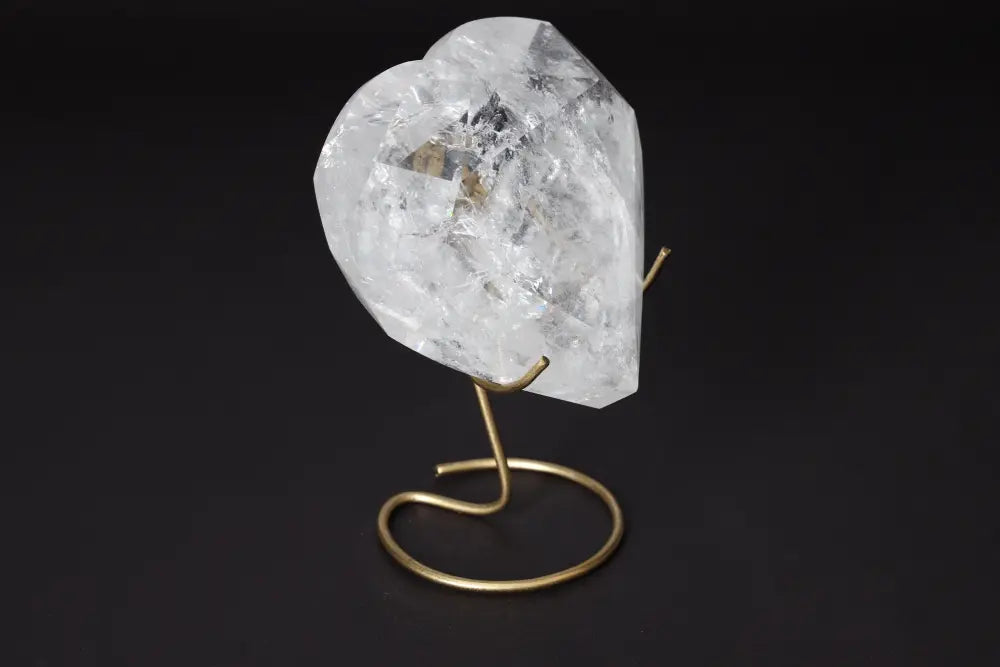 Lemurian Quartz Geometric Heart crystal on stand, offering spiritual connection and purification, from Sylvia Crystals.