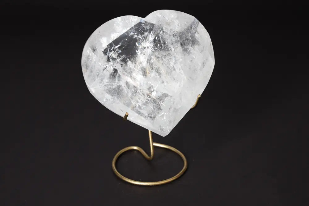 Lemurian Quartz Geometric Heart crystal on stand from Sylvia Crystals, showcasing purity and spiritual luxury.