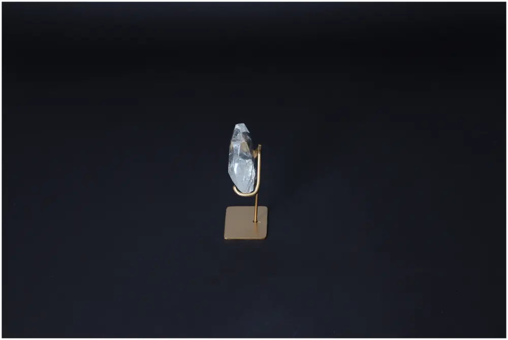 Lemurian Quartz Geometric Heart on stand, showcasing its clear, purifying properties against a dark background for energy harmonization.