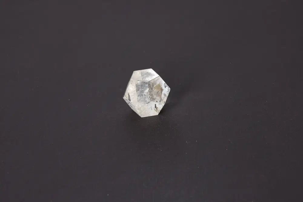 Lemurian Quartz Geometric Sphere 3.5 cm displaying sacred geometry against a dark background, highlighting its spiritual and intuitive properties.