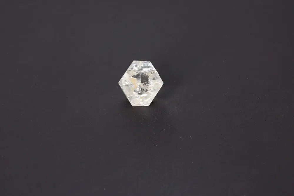 Lemurian Quartz geometric sphere, 3.5 cm, showcasing sacred geometry on a dark background.