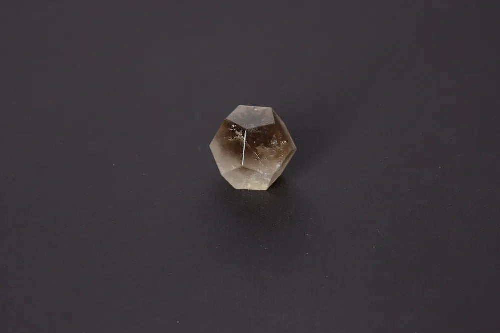 Lemurian Quartz Sphere in geometric shape with ethereal clarity on black background, 4 cm sacred geometry crystal for spiritual awakening.