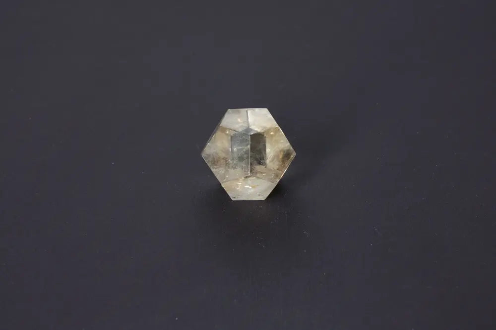 Lemurian Quartz geometric sphere with sacred geometry, showcasing ethereal clarity and ancient wisdom, on a dark background.