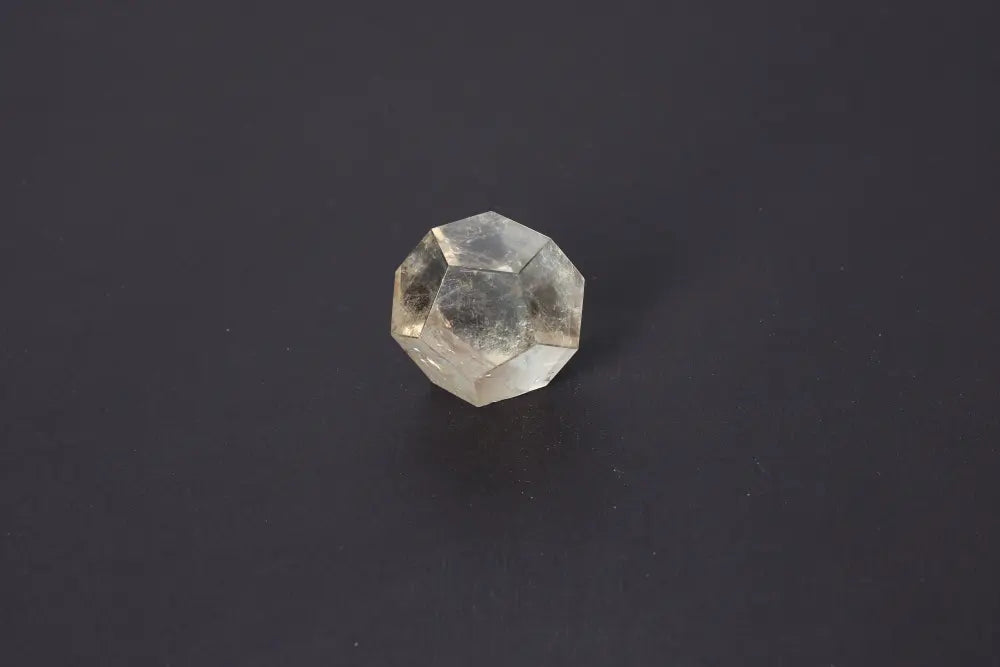 Lemurian Quartz Geometric Sphere 4.5 cm on a black background, showcasing sacred geometry and ancient wisdom.