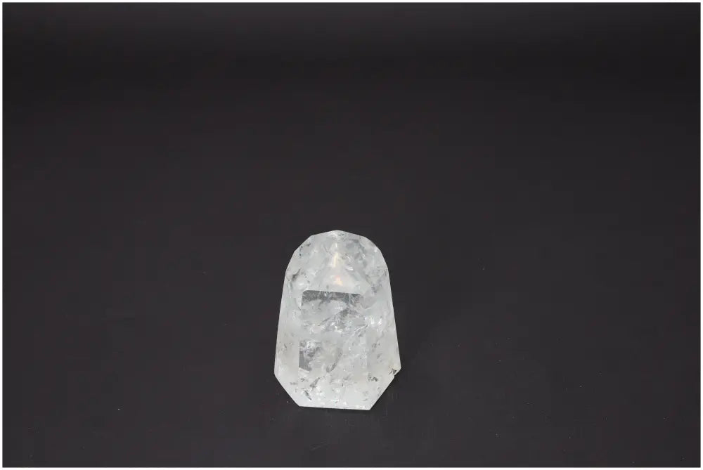 Lemurian Quartz Obelisk enhancing spiritual energy for chakra balancing and zodiac alignment on a dark background.