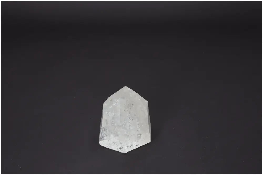 Lemurian Quartz Obelisk on dark background, highlighting its spiritual and energetic properties for chakra and zodiac sign support.