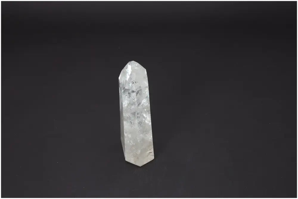 Lemurian Quartz Obelisk with unique energetically supportive properties for chakra alignment on black background.
