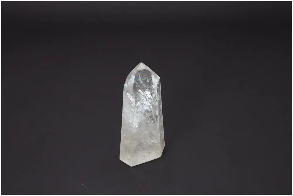 Lemurian Quartz Obelisk against dark background, showcasing its spiritual and energetic properties for chakra and zodiac support.
