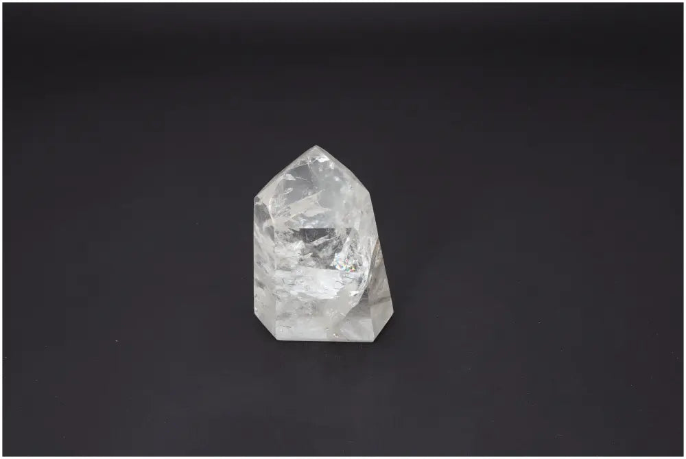 Lemurian Quartz Obelisk on dark background, showcasing unique energetic properties for chakra and zodiac alignment.